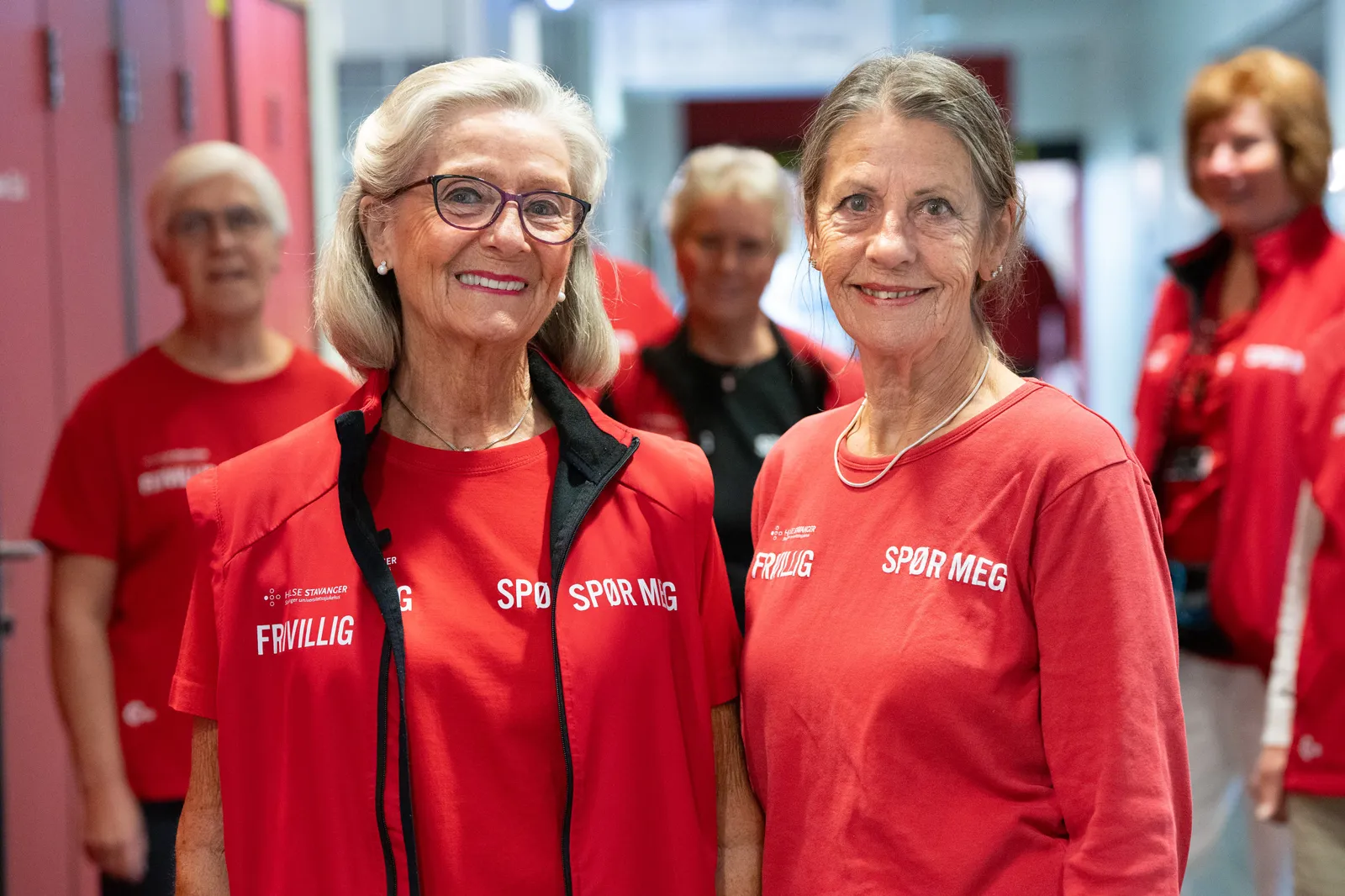 A group of women in red shirts