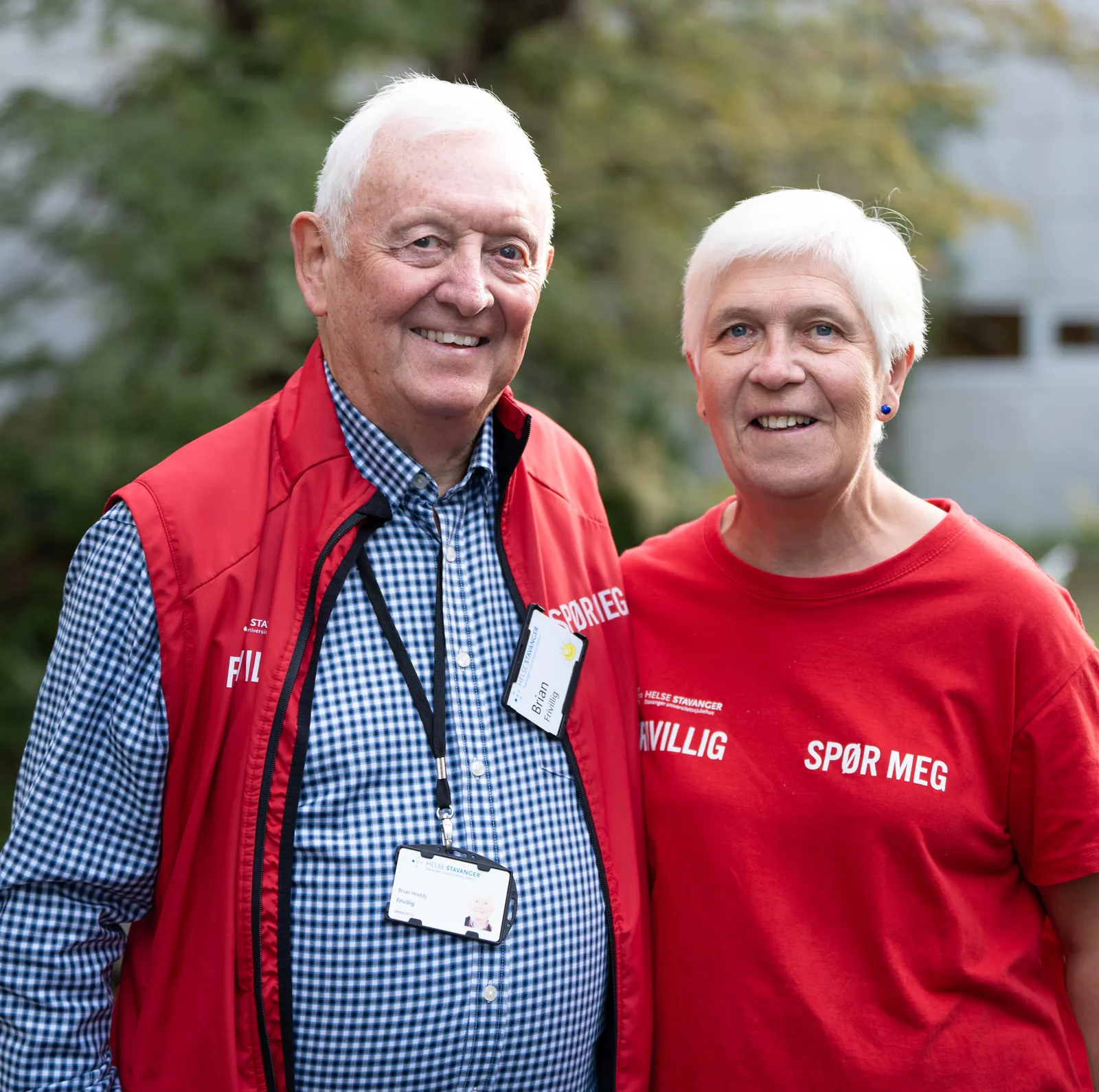 A man and woman smiling