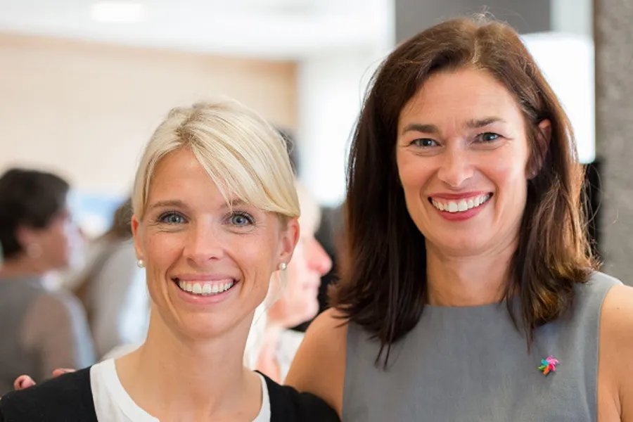 A couple of women smiling