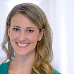 A close-up of a woman smiling